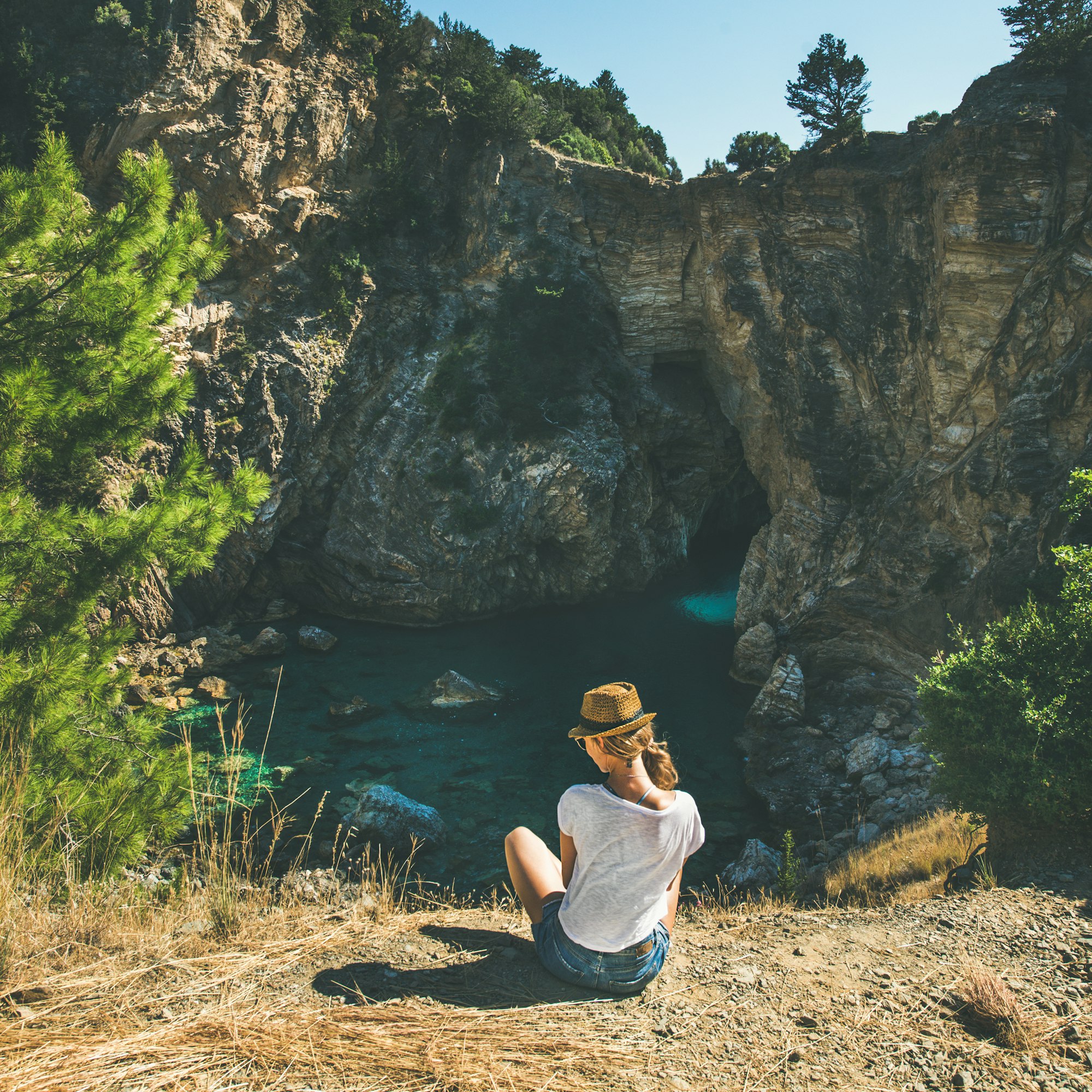 young-woman-sitting-near-bay-antiocheia-ad-cragum-ancient-town.jpg